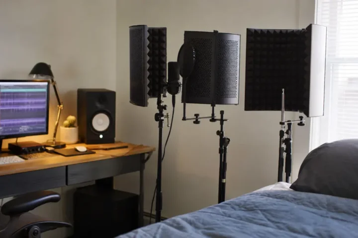 Several generic reflection filter styles around a vocal microphone in a bedroom recording corner